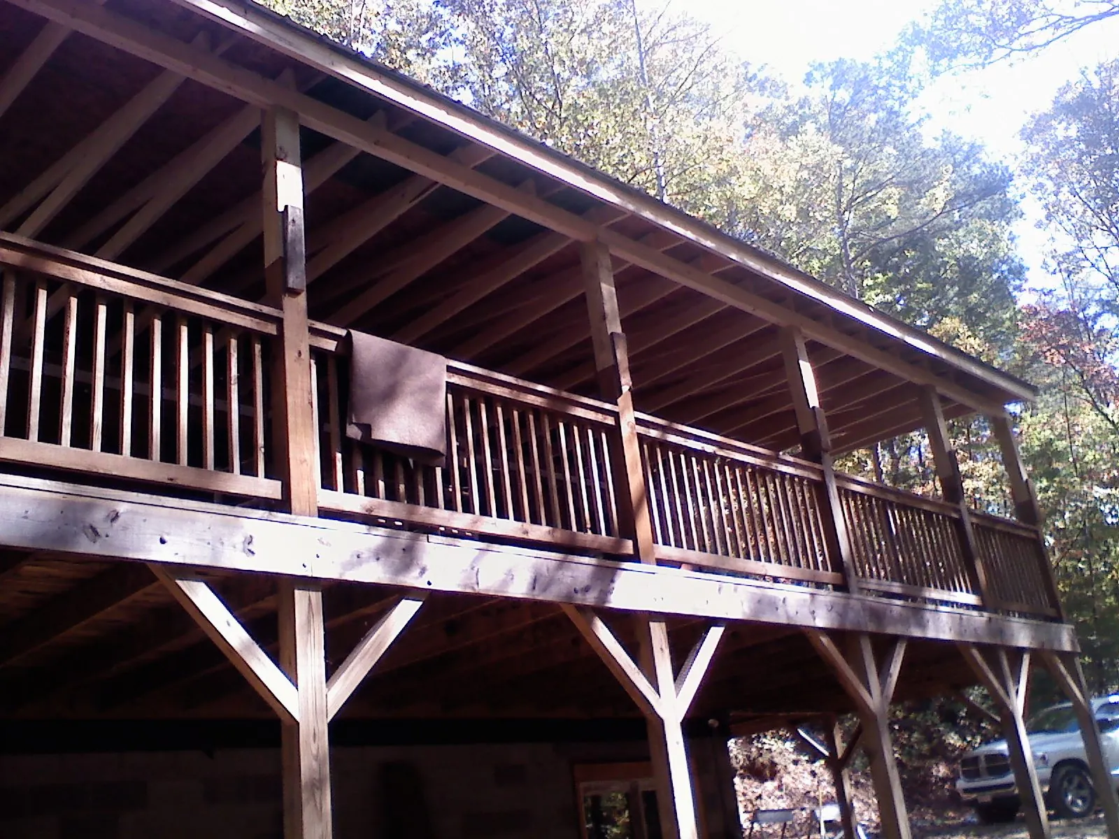 Timber framing under a new elevated porch and deck — Roof Leak Repair in Glenwood Landing by Roofing Brothers